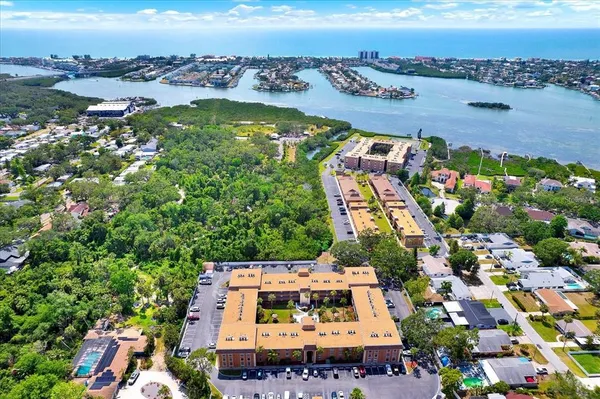 a kitchen with stainless steel appliances granite countertop a sink refrigerator and microwave