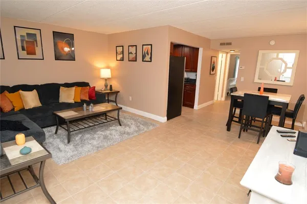 a kitchen with granite countertop a sink a stove and cabinets