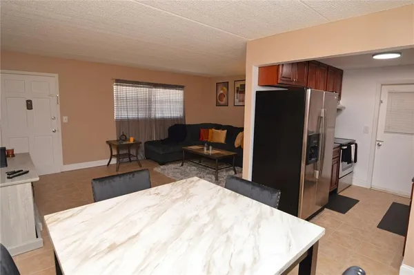 a kitchen with granite countertop stainless steel appliances and wooden cabinets