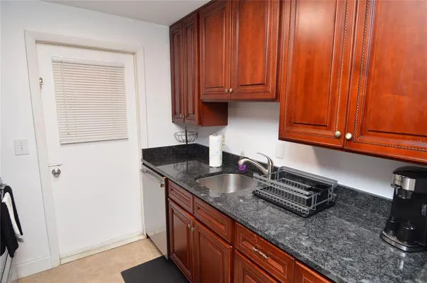 a living room with furniture rug and window