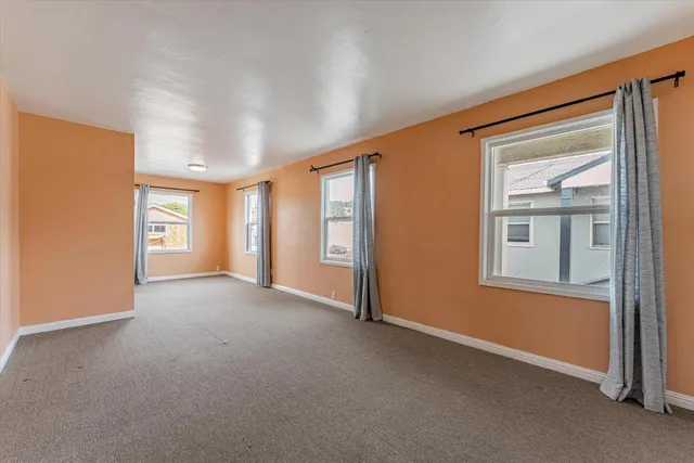 a view of empty room with windows