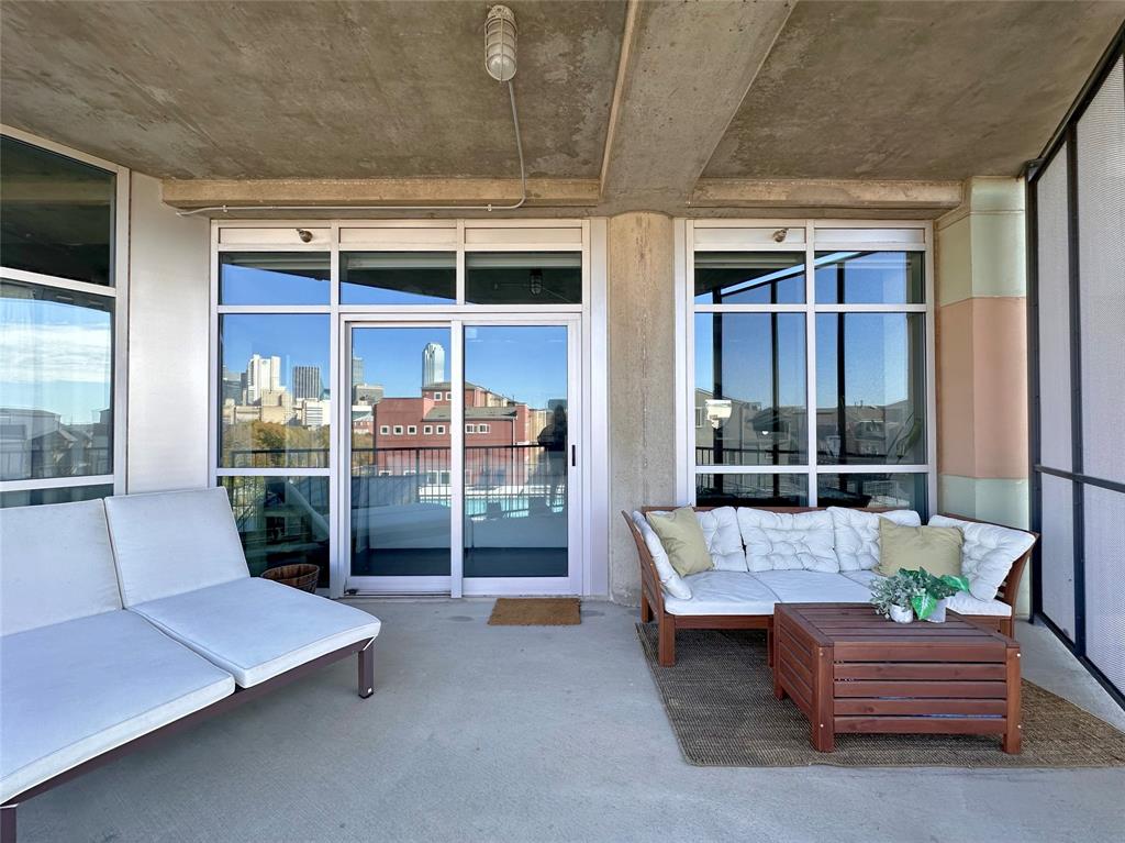 1001 Belleview Street, Unit 307 Dallas, TX 75215 - Photo 12 of 36 Large balcony is perfect place to relax and soak inthe amazing Dallas skyline views! Reflective privacyenhances privacy and also contributes to energyefficiency by reflecting sunlight.