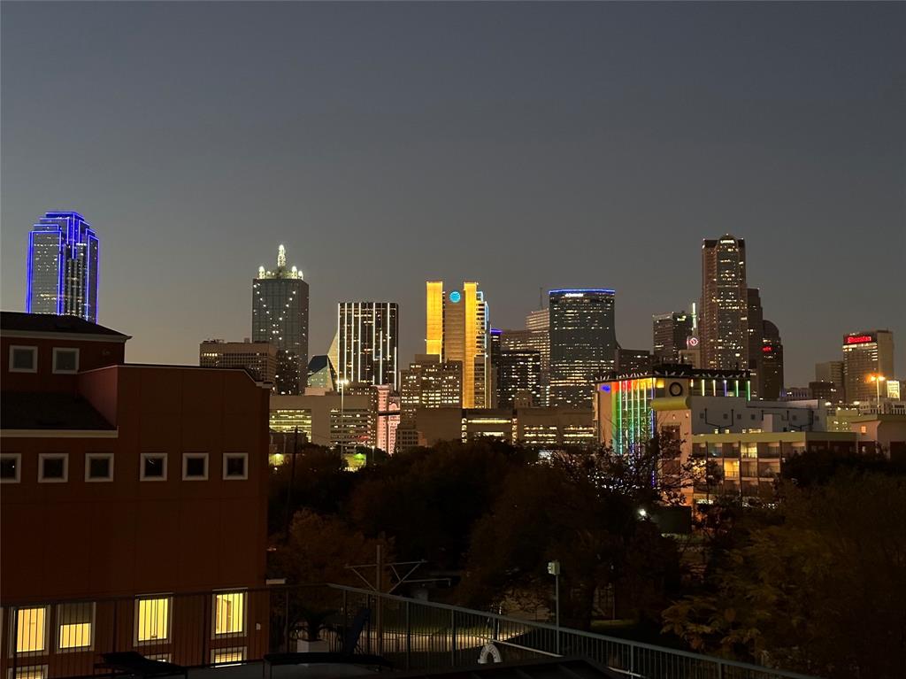 1001 Belleview Street, Unit 307 Dallas, TX 75215 - Photo 2 of 36 Magnificent evening Dallas skyline views from theoversize balcony where you can lounge comfortablyand soak in the nightly city lights!