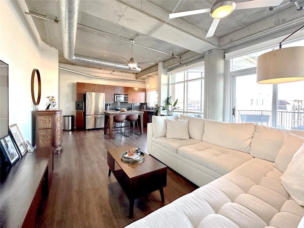 1001 Belleview Street, Unit 307 Dallas, TX 75215 - Photo 23 of 36 Floor to ceiling windows let plenty of natural lightin. If desired, electric shades can provide roomdarkening or privacy.