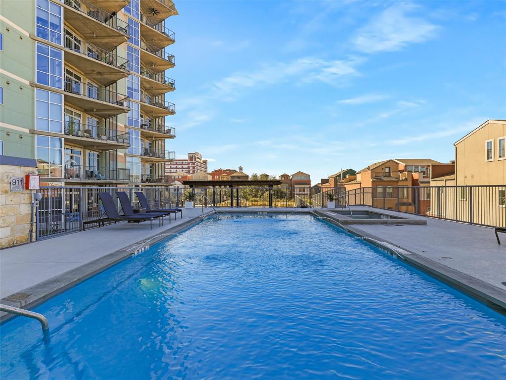 1001 Belleview Street, Unit 307 Dallas, TX 75215 - Photo 32 of 36 Pool with water feature and separate spa and lotsof pool decking for lounging