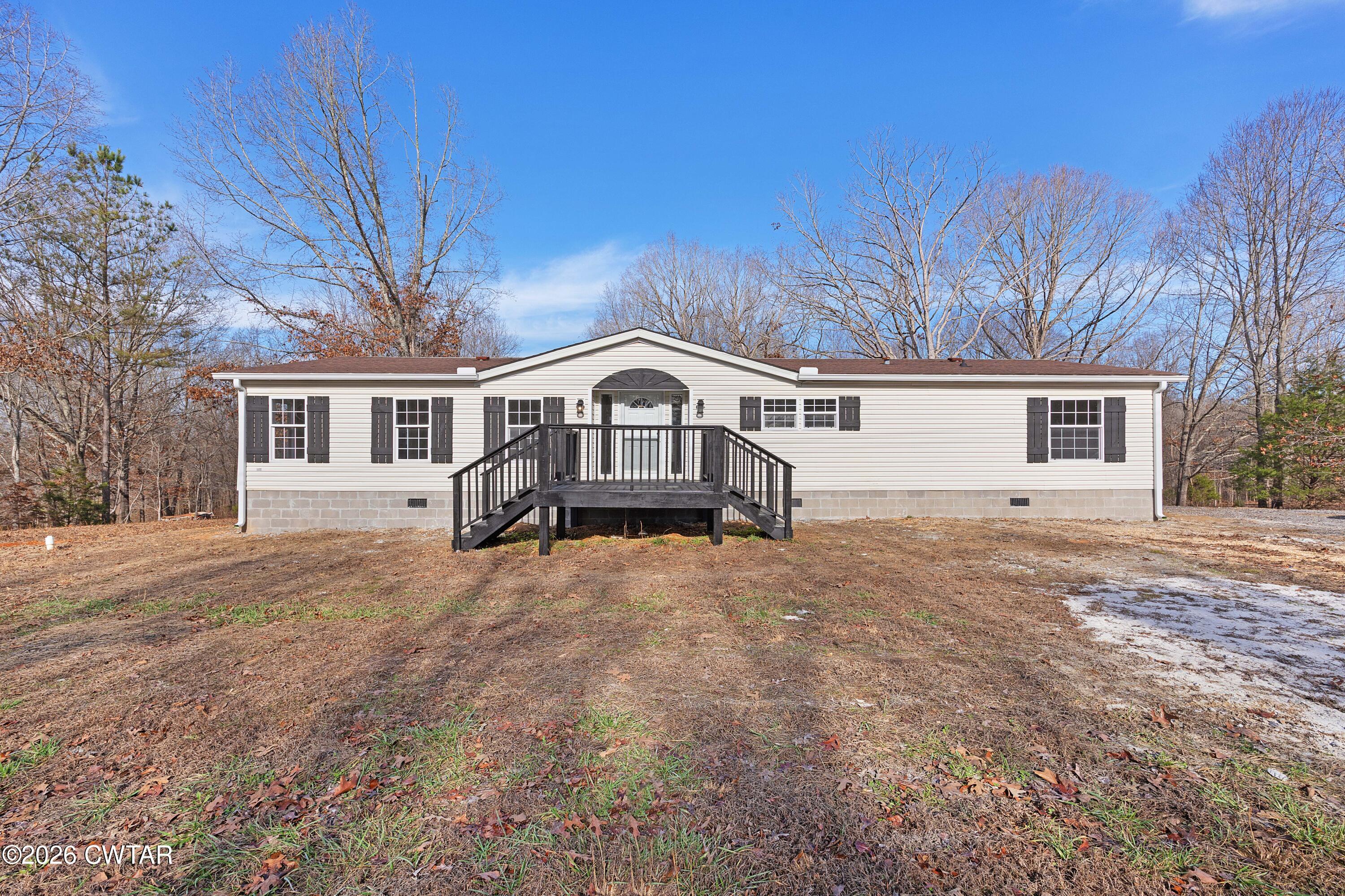 1920 Parkburg Road Medon, TN 38356 - Photo 1 of 17 front view of a house with a dry yard