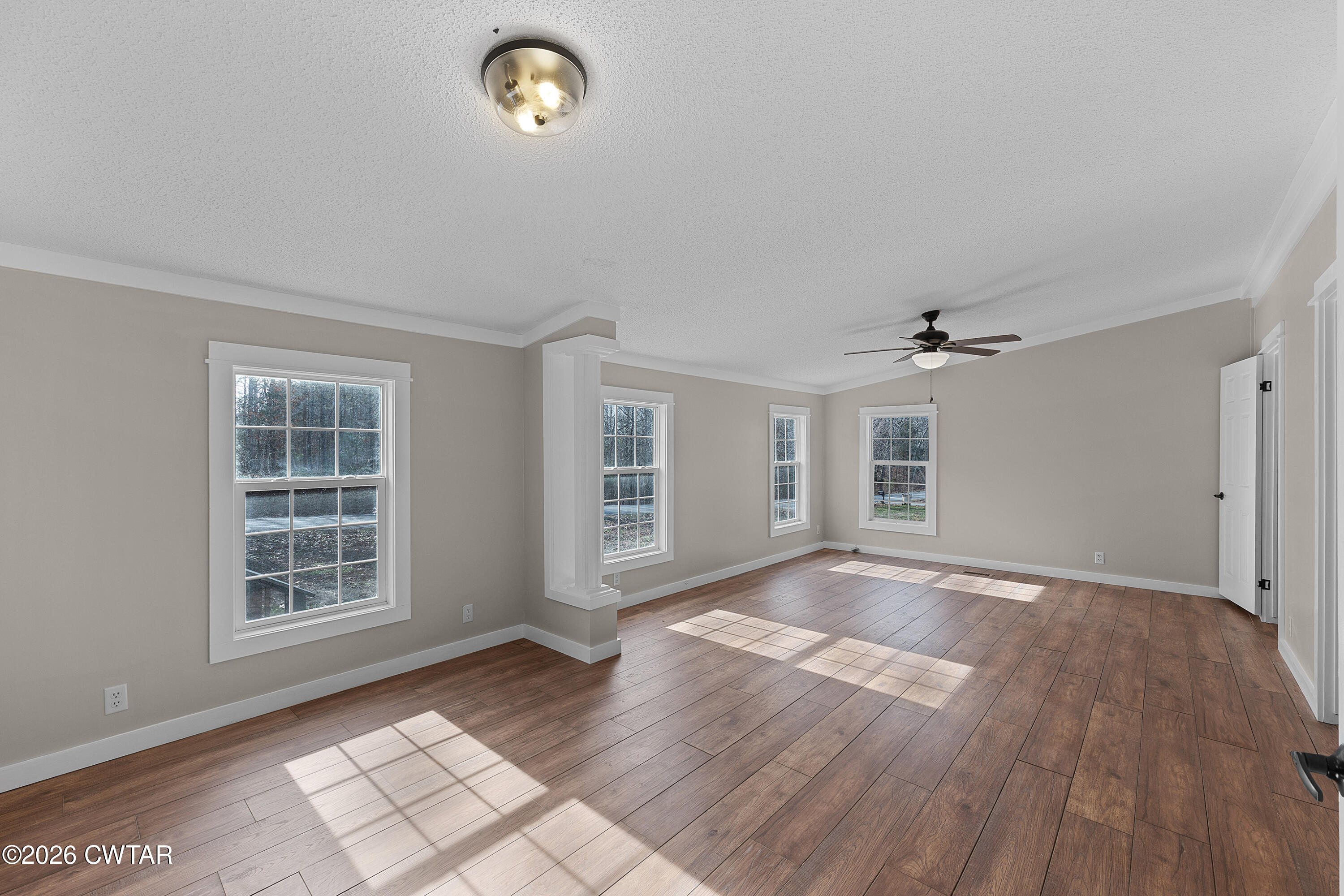 1920 Parkburg Road Medon, TN 38356 - Photo 11 of 17 a view of an empty room with a window and wooden floor