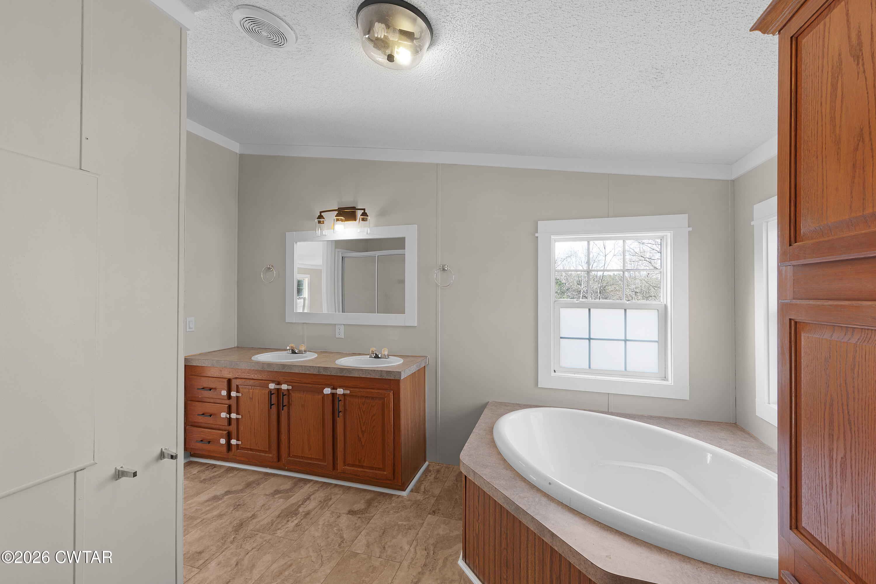 1920 Parkburg Road Medon, TN 38356 - Photo 13 of 17 a bathroom with a tub sink and mirror
