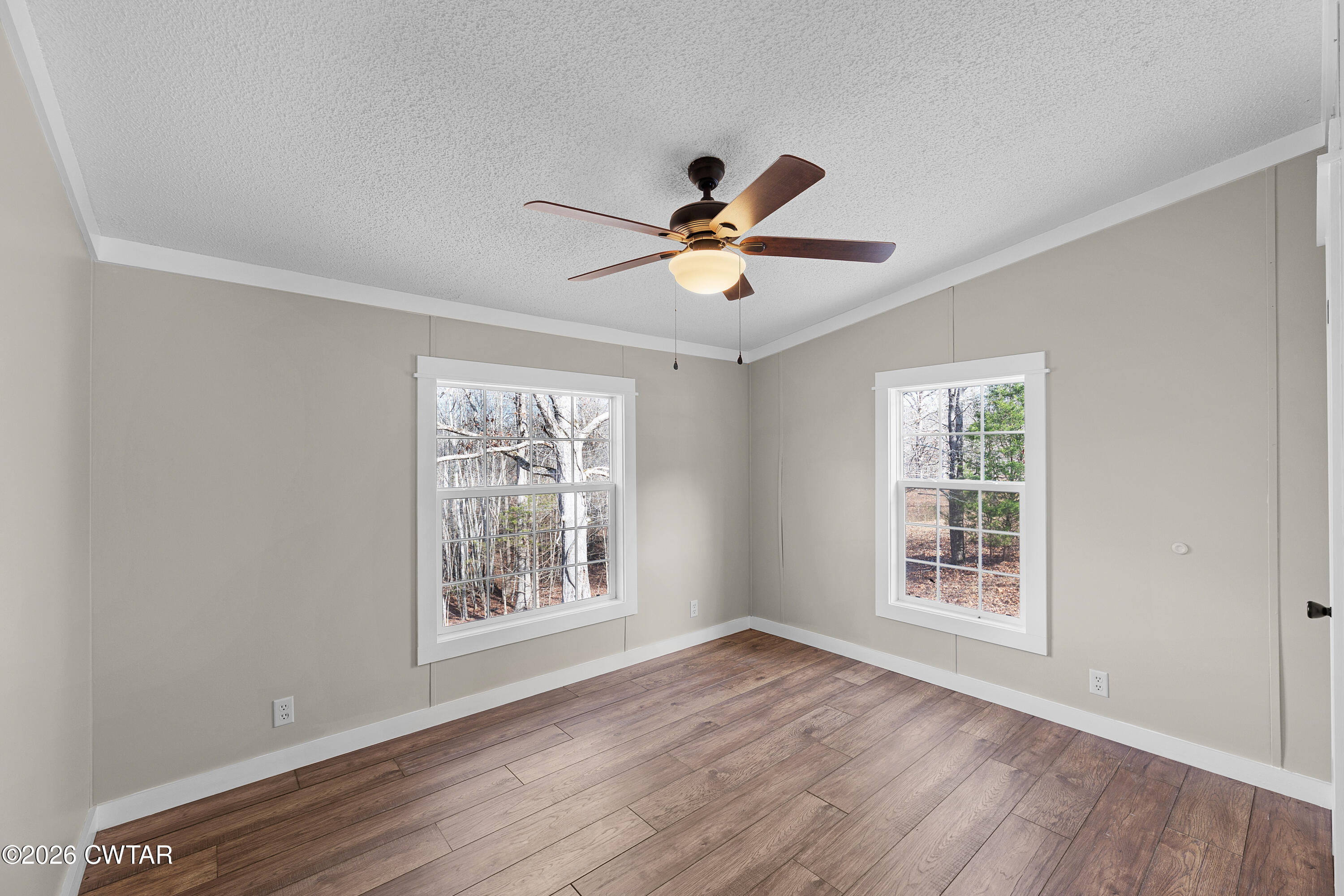 1920 Parkburg Road Medon, TN 38356 - Photo 15 of 17 a view of an empty room with a window and wooden floor