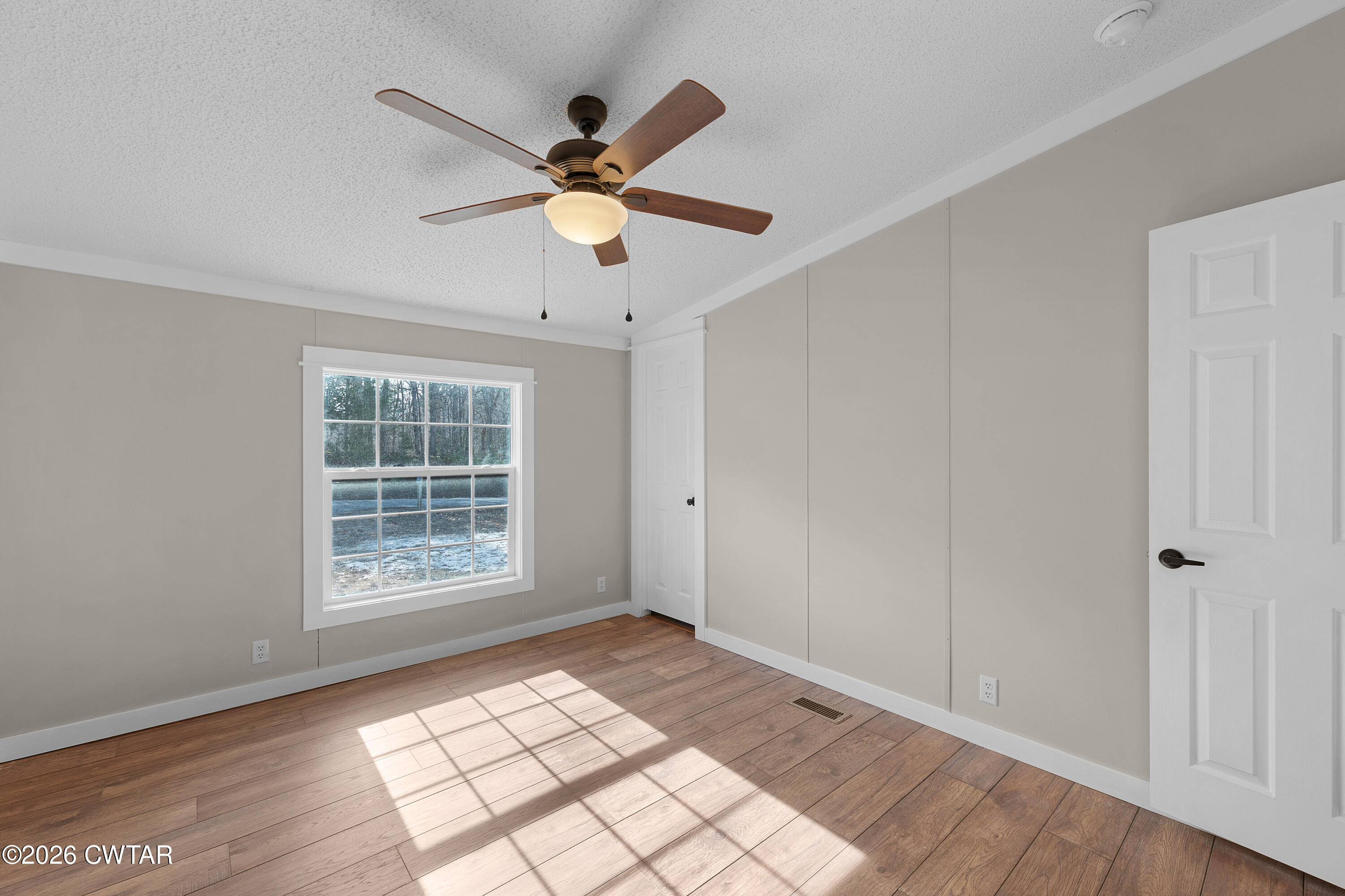1920 Parkburg Road Medon, TN 38356 - Photo 16 of 17 wooden floor in an empty room with a window