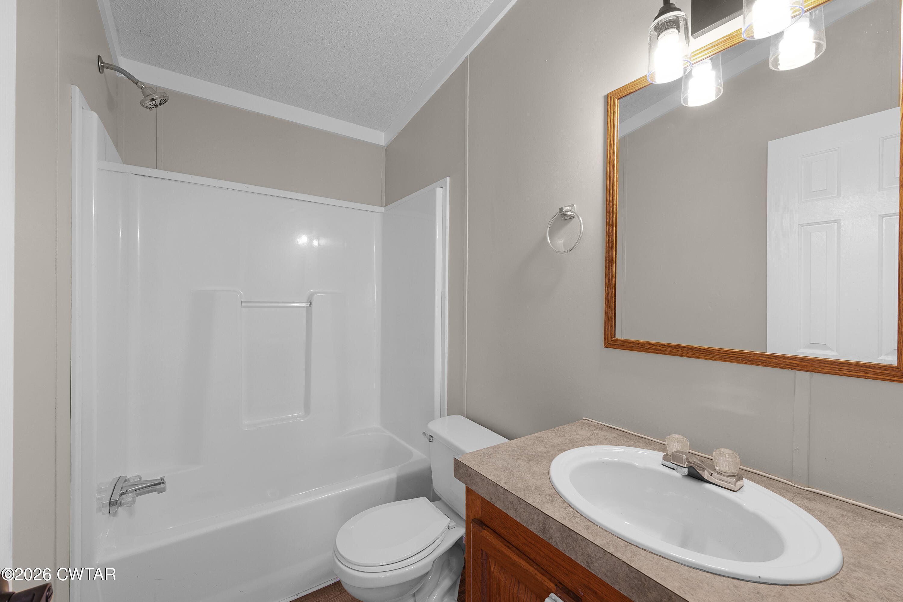 1920 Parkburg Road Medon, TN 38356 - Photo 17 of 17 a bathroom with a sink toilet and shower