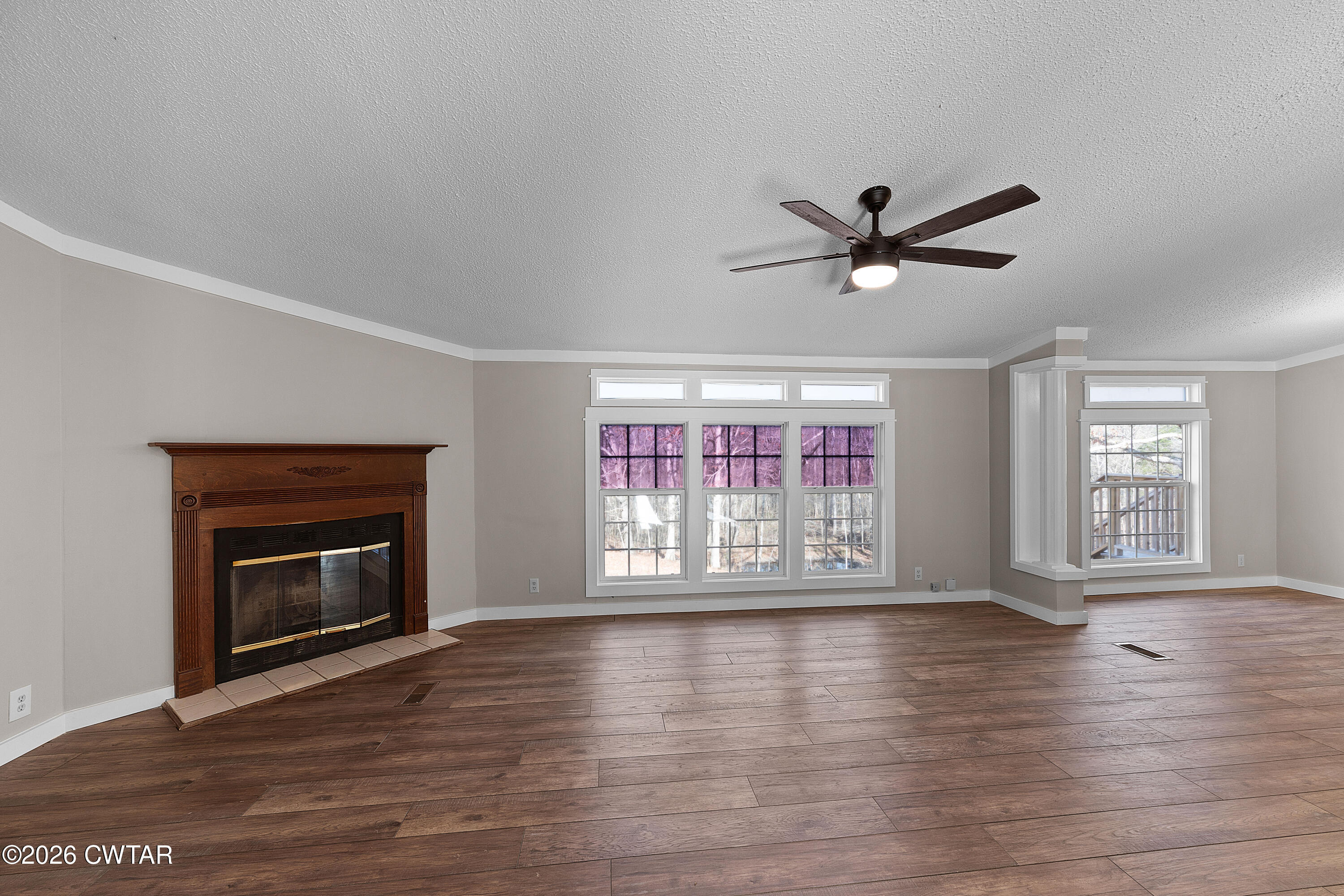 1920 Parkburg Road Medon, TN 38356 - Photo 6 of 17 a view of an empty room with wooden floor and a window