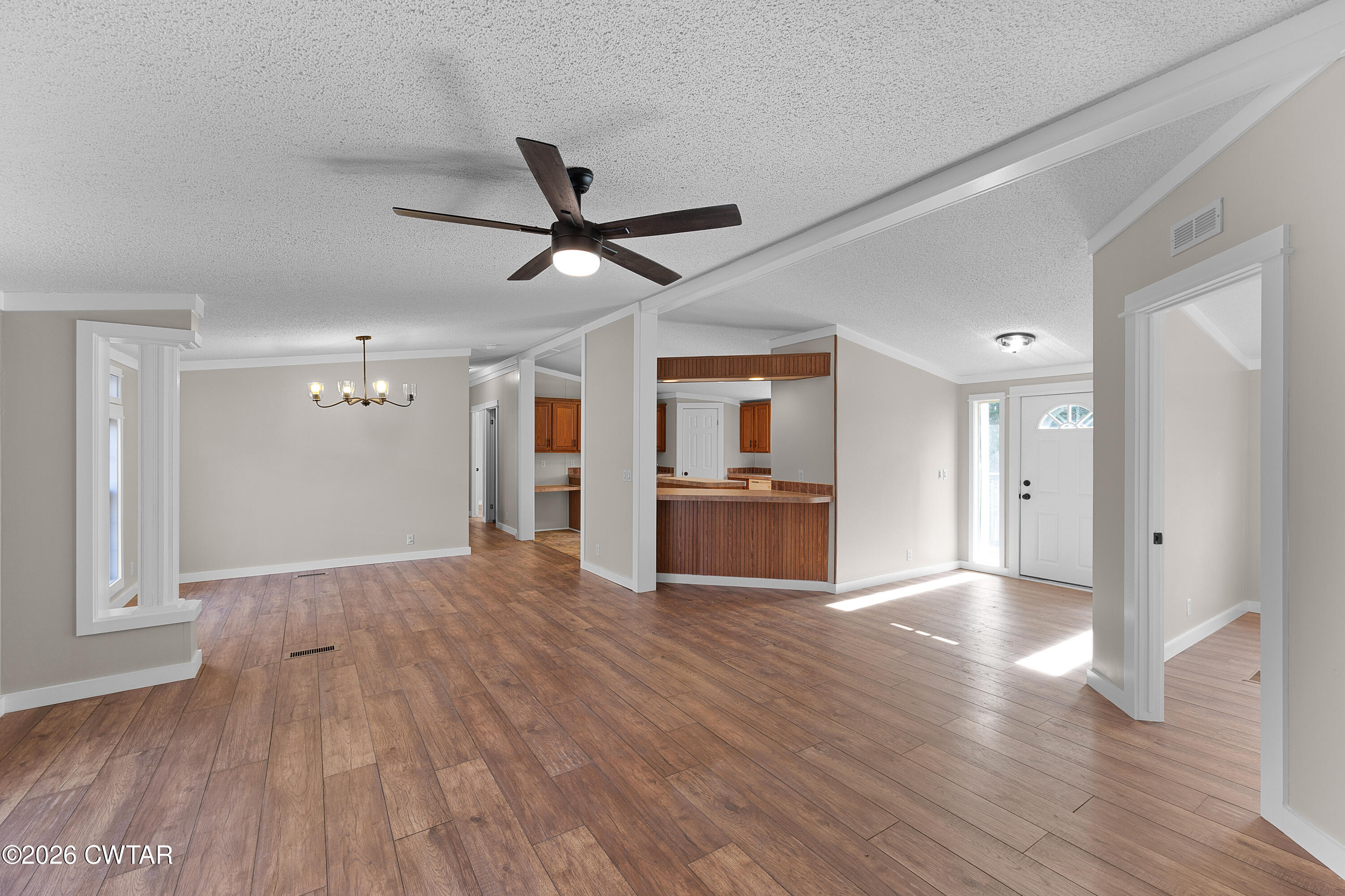 1920 Parkburg Road Medon, TN 38356 - Photo 7 of 17 a view of a livingroom with wooden floor and a ceiling fan