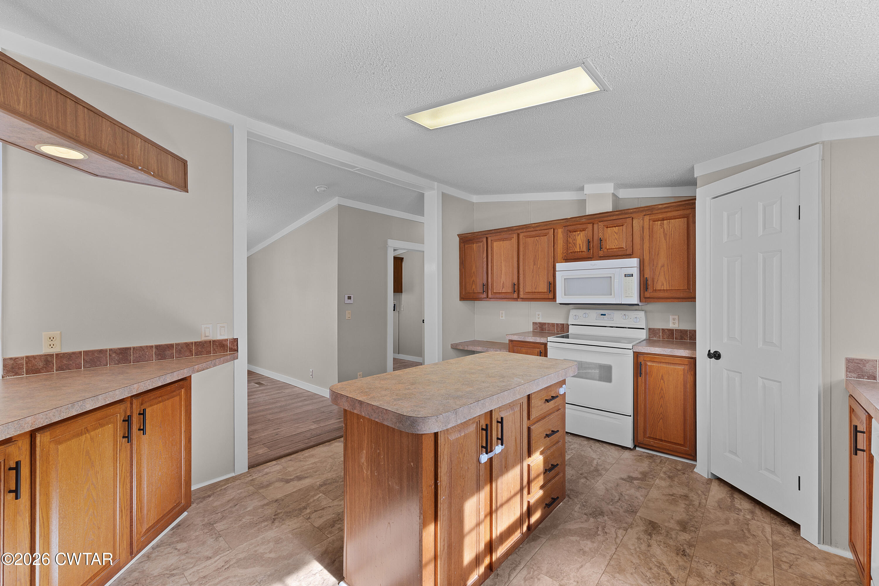 1920 Parkburg Road Medon, TN 38356 - Photo 10 of 17 a kitchen with a stove a refrigerator and a sink