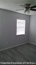 357 US Highway 27 South Sebring, FL 33870 - Photo 6 of 10 an empty room with wooden floor and windows