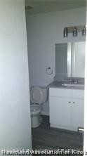 357 US Highway 27 South Sebring, FL 33870 - Photo 7 of 10 a bathroom with a sink and a mirror