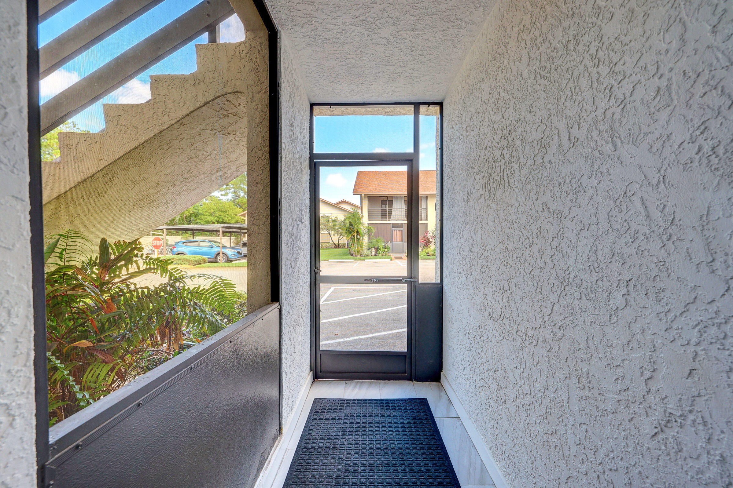 a view of a glass door with a view of balcony