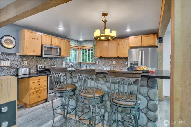 a kitchen with a sink cabinets and window