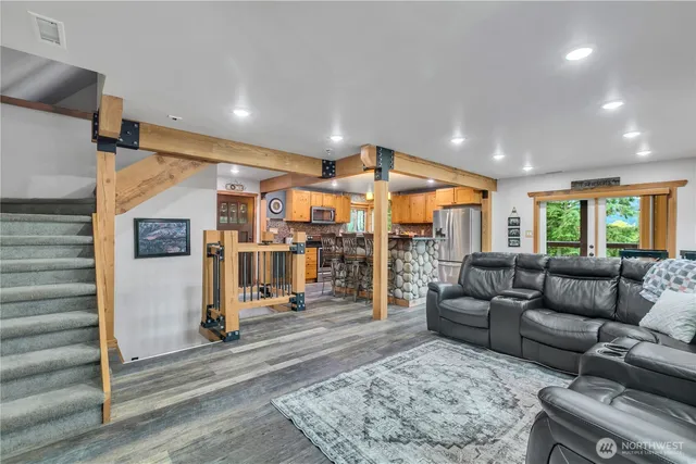 a living room with furniture and a rug