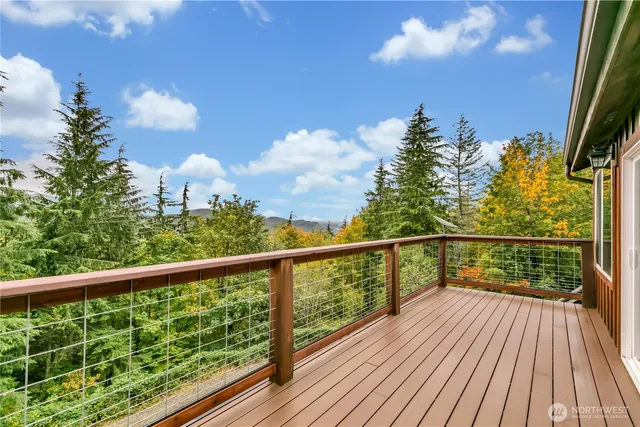 a view of a balcony with wooden floor