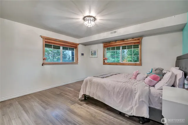 a workspace with furniture hardwood and a window