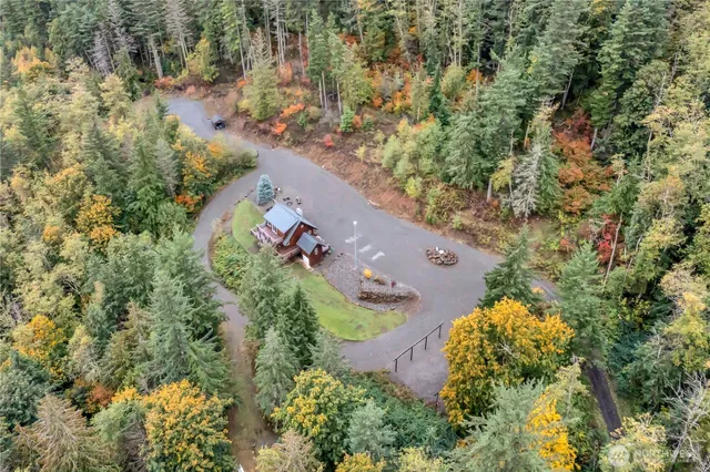 an aerial view of a house with a yard