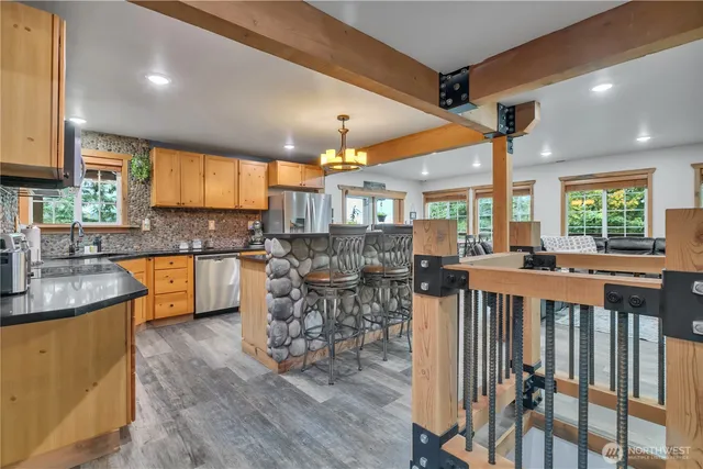 a kitchen with lots of counter top space and furniture