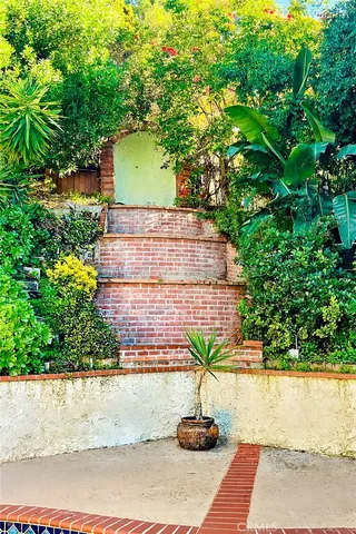 a view of a house with a small yard
