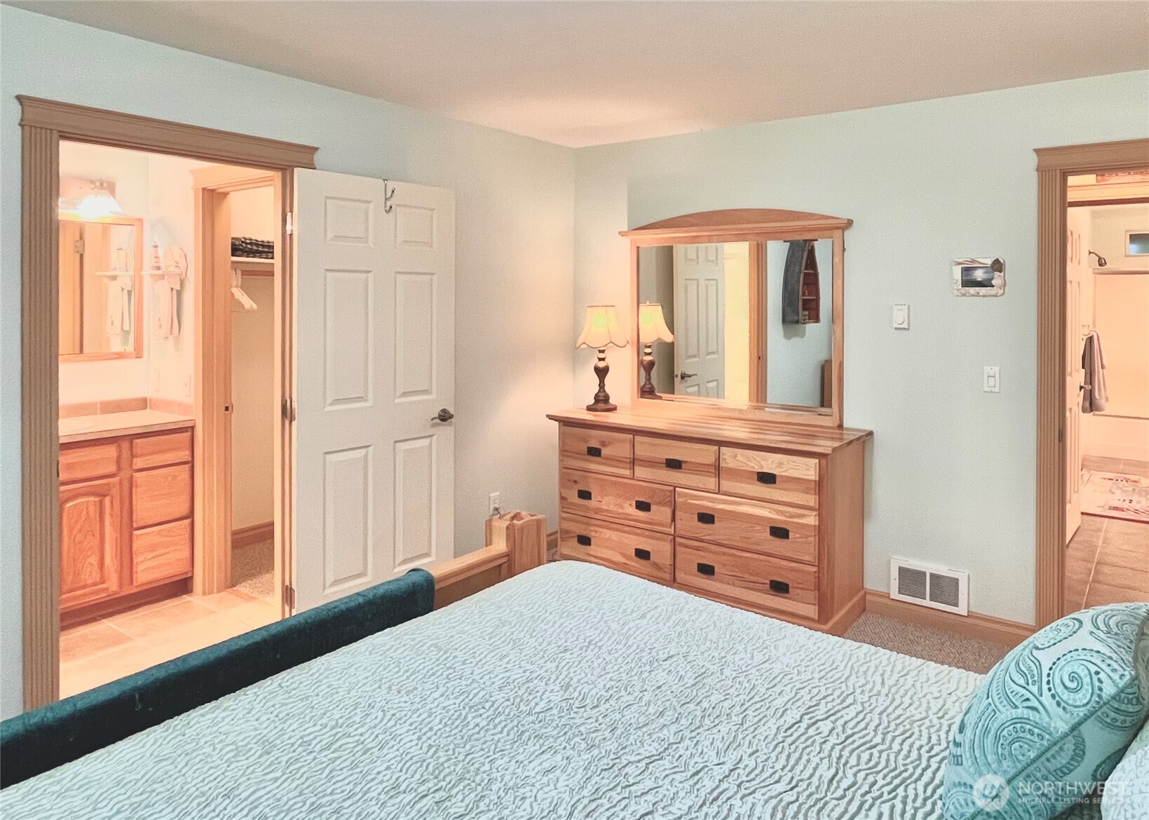 137 North Razor Clam Drive Southwest Ocean Shores, WA 98569 - Photo 11 of 31 a bedroom with a dresser next to a window