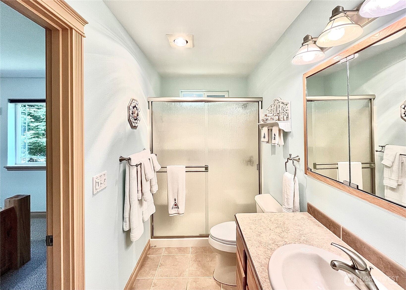 137 North Razor Clam Drive Southwest Ocean Shores, WA 98569 - Photo 12 of 31 a bathroom with a sink a toilet and shower
