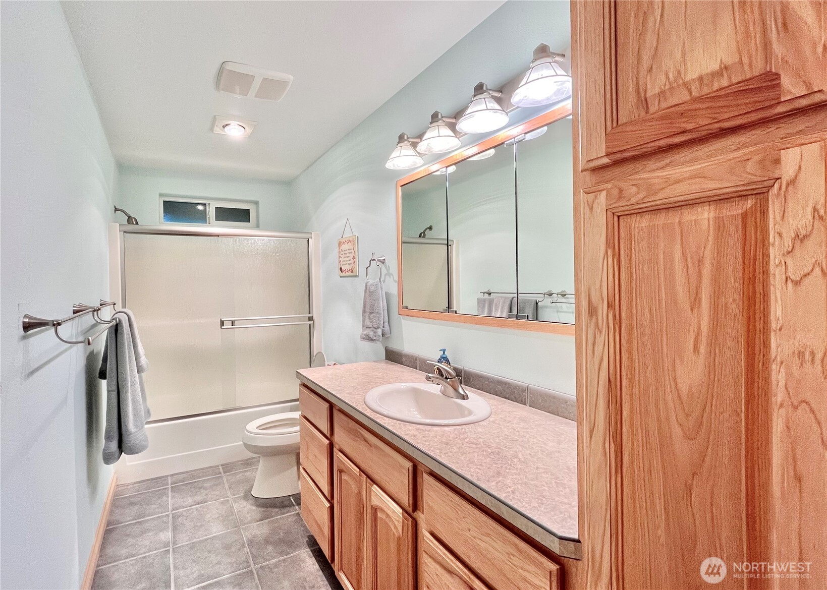 137 North Razor Clam Drive Southwest Ocean Shores, WA 98569 - Photo 14 of 31 a bathroom with a sink a toilet and shower