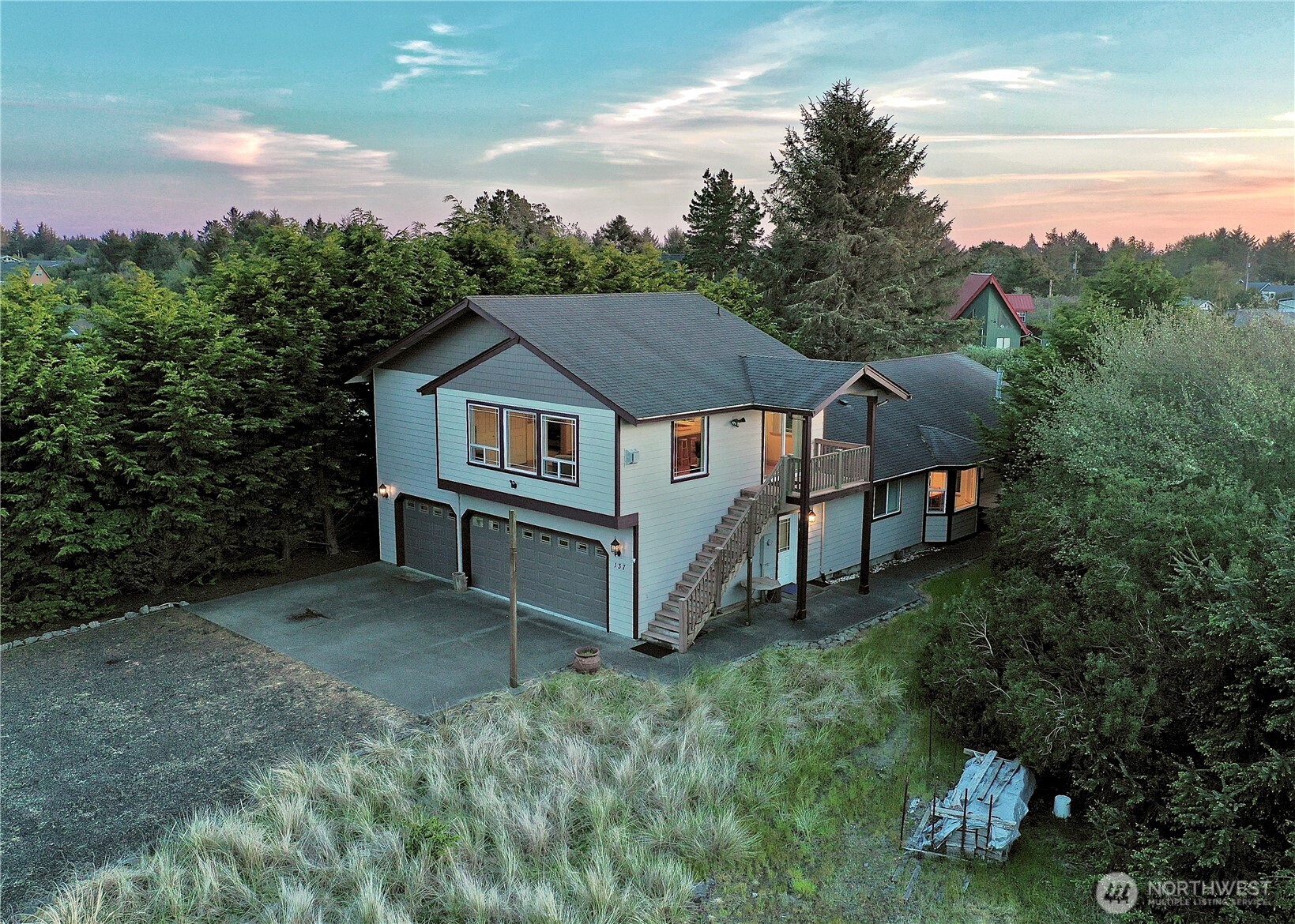 137 North Razor Clam Drive Southwest Ocean Shores, WA 98569 - Photo 2 of 31 a view of a house with a yard and sitting area