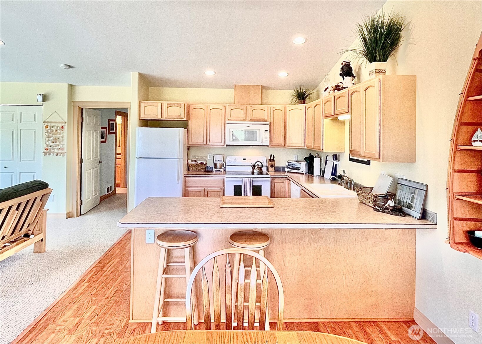 137 North Razor Clam Drive Southwest Ocean Shores, WA 98569 - Photo 24 of 31 a large kitchen with a table and chairs