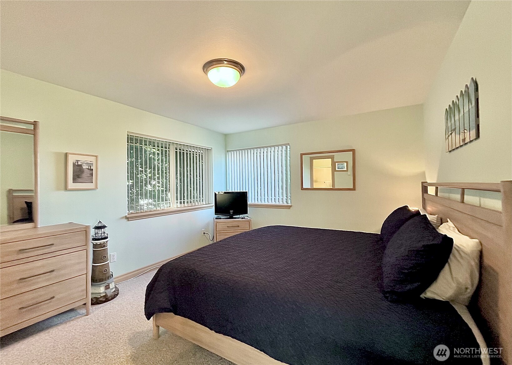 137 North Razor Clam Drive Southwest Ocean Shores, WA 98569 - Photo 27 of 31 a bedroom with a bed and a window