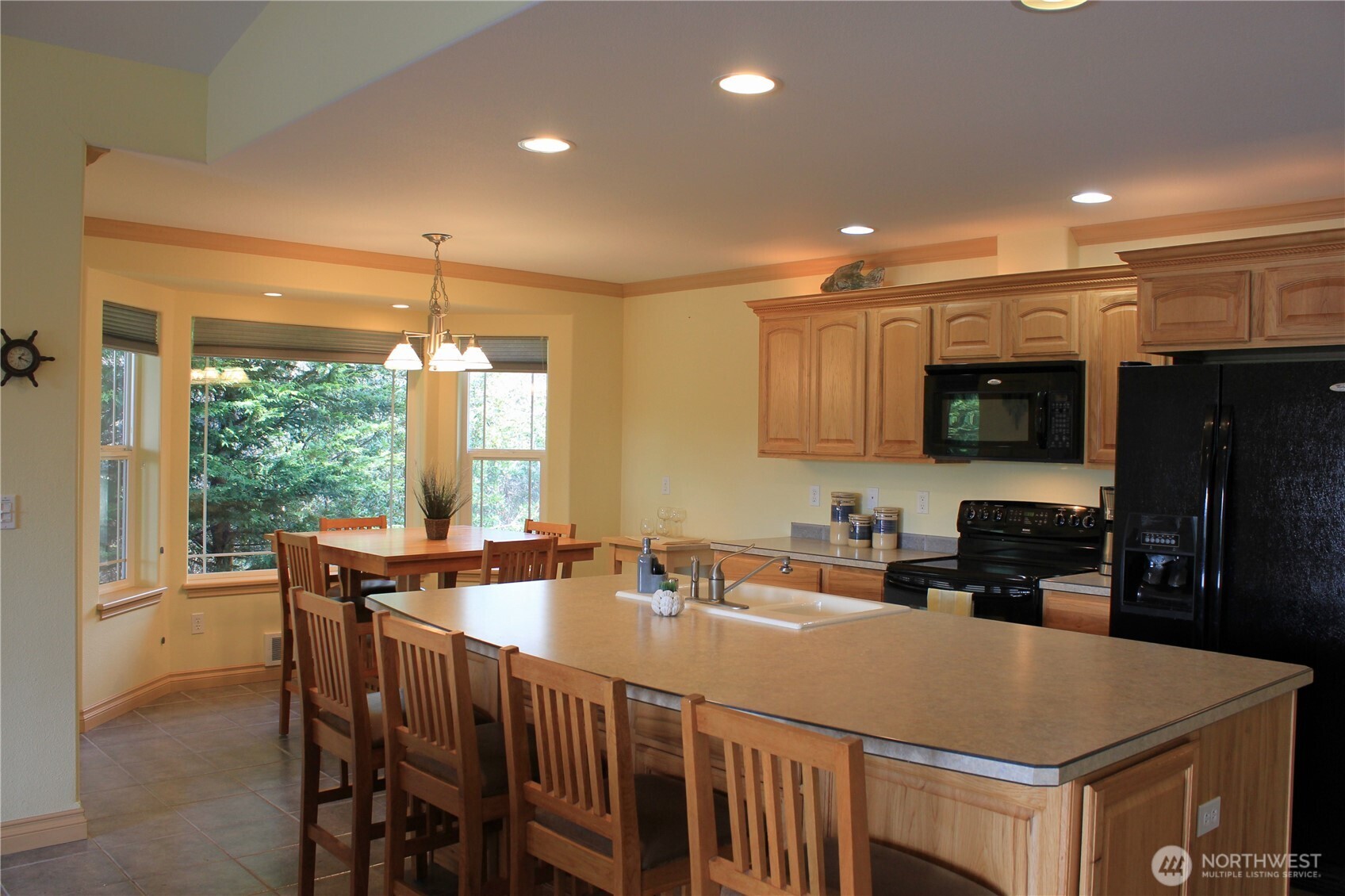 137 North Razor Clam Drive Southwest Ocean Shores, WA 98569 - Photo 5 of 31 a kitchen with a stove a sink and a refrigerator