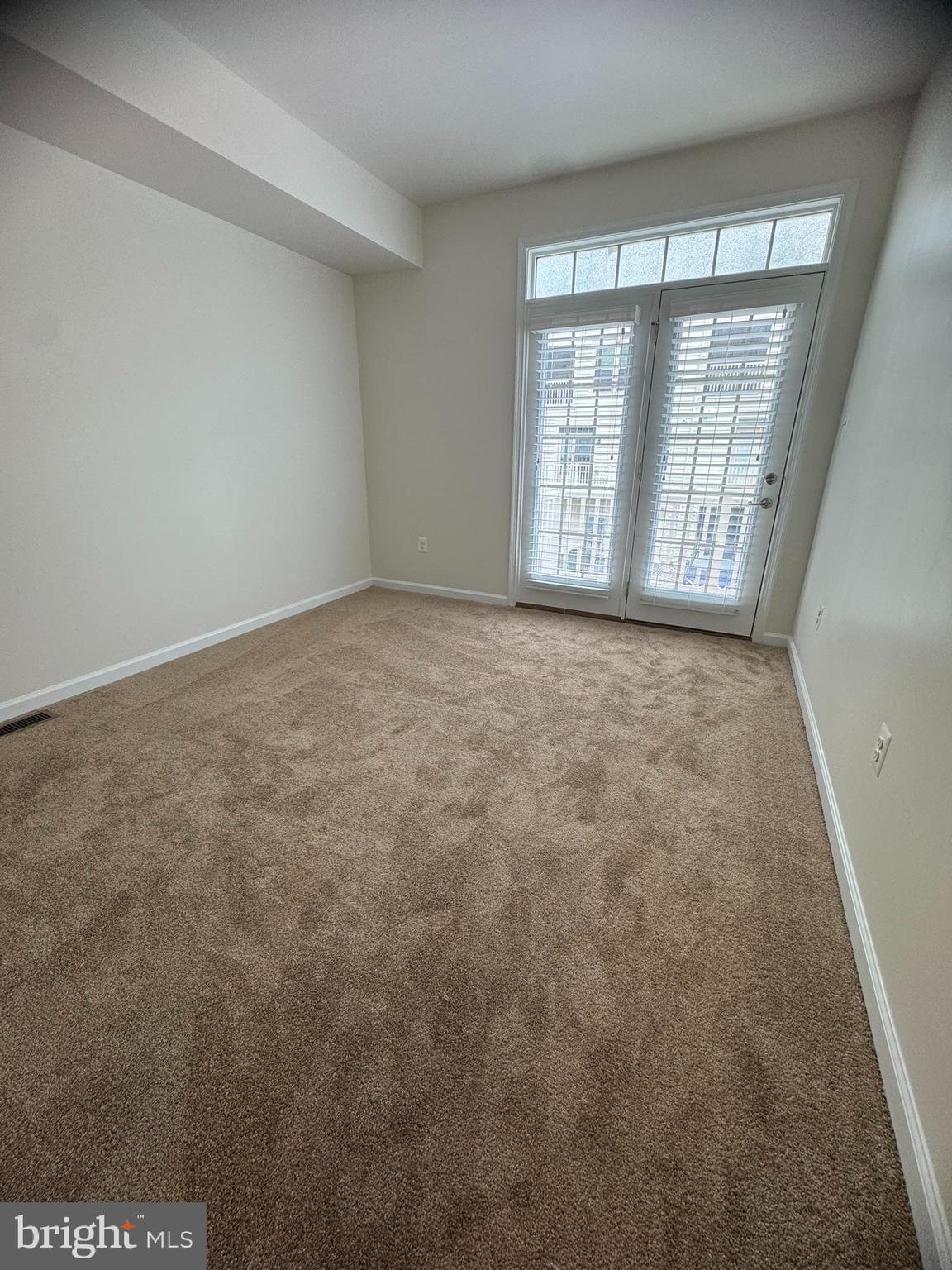 6436 Walcott Lane Frederick, MD 21703 - Photo 17 of 27 a view of an empty room with a window