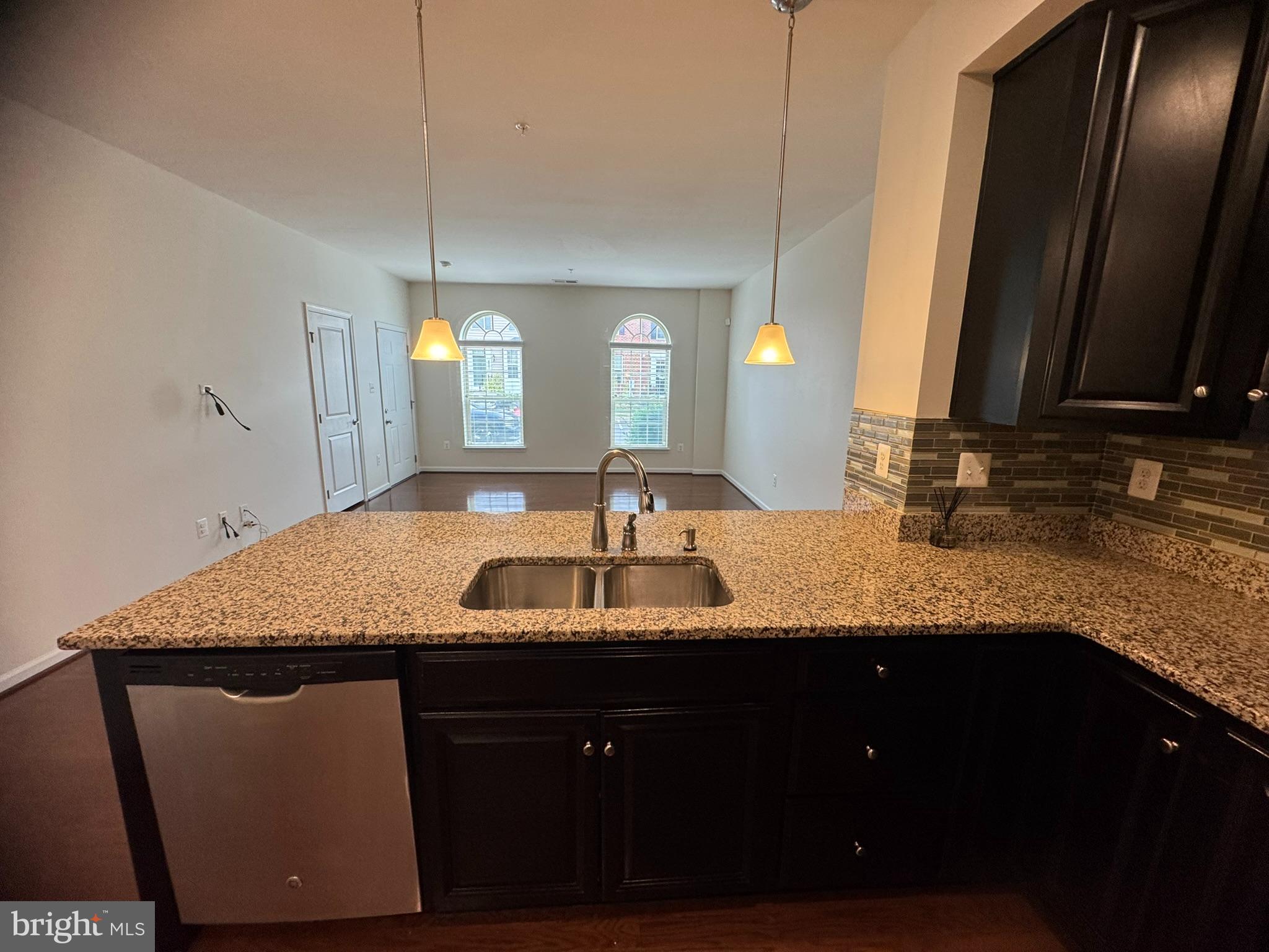 6436 Walcott Lane Frederick, MD 21703 - Photo 23 of 27 a bathroom with a granite countertop sink a mirror and shower