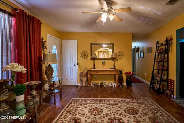 a living room with furniture and a rug