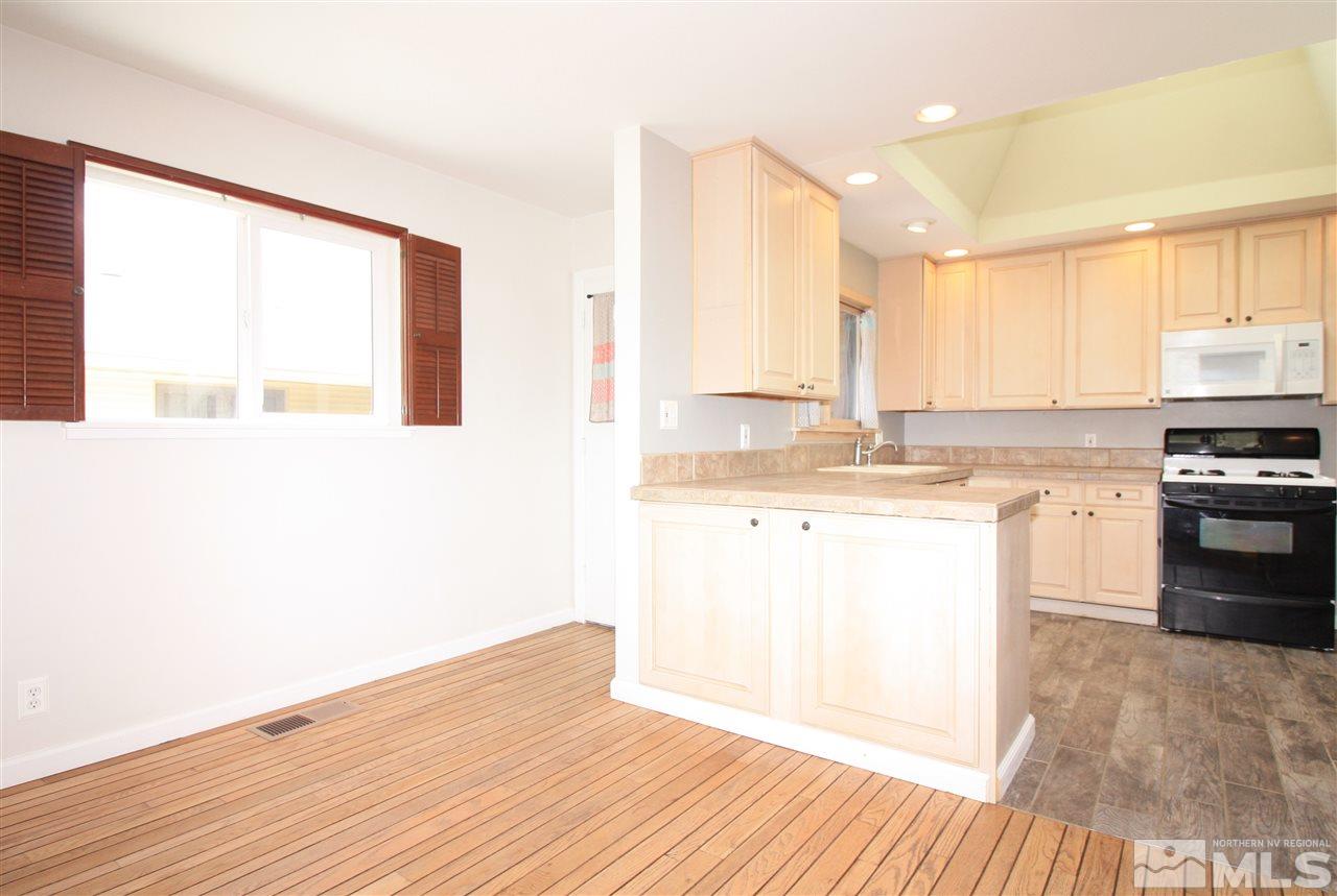 1280 Tacoma Way Reno, NV 89509 - Photo 5 of 36 a kitchen with a sink wooden floor and view living room