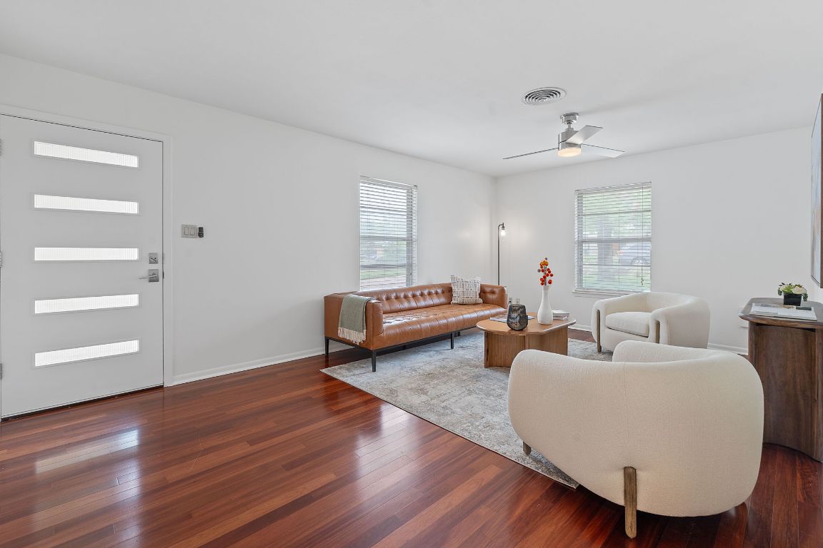 6810 Daugherty Street Austin, TX 78757 - Photo 1 of 1 a living room with furniture and wooden floor