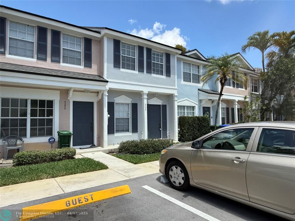 5295 Jamboree Place Margate, FL 33063 - Photo 1 of 35 a car parked in front of a house