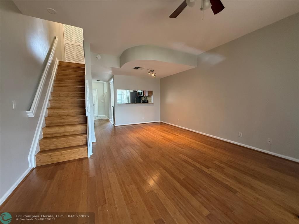 5295 Jamboree Place Margate, FL 33063 - Photo 15 of 35 wooden floor in an empty room with a window