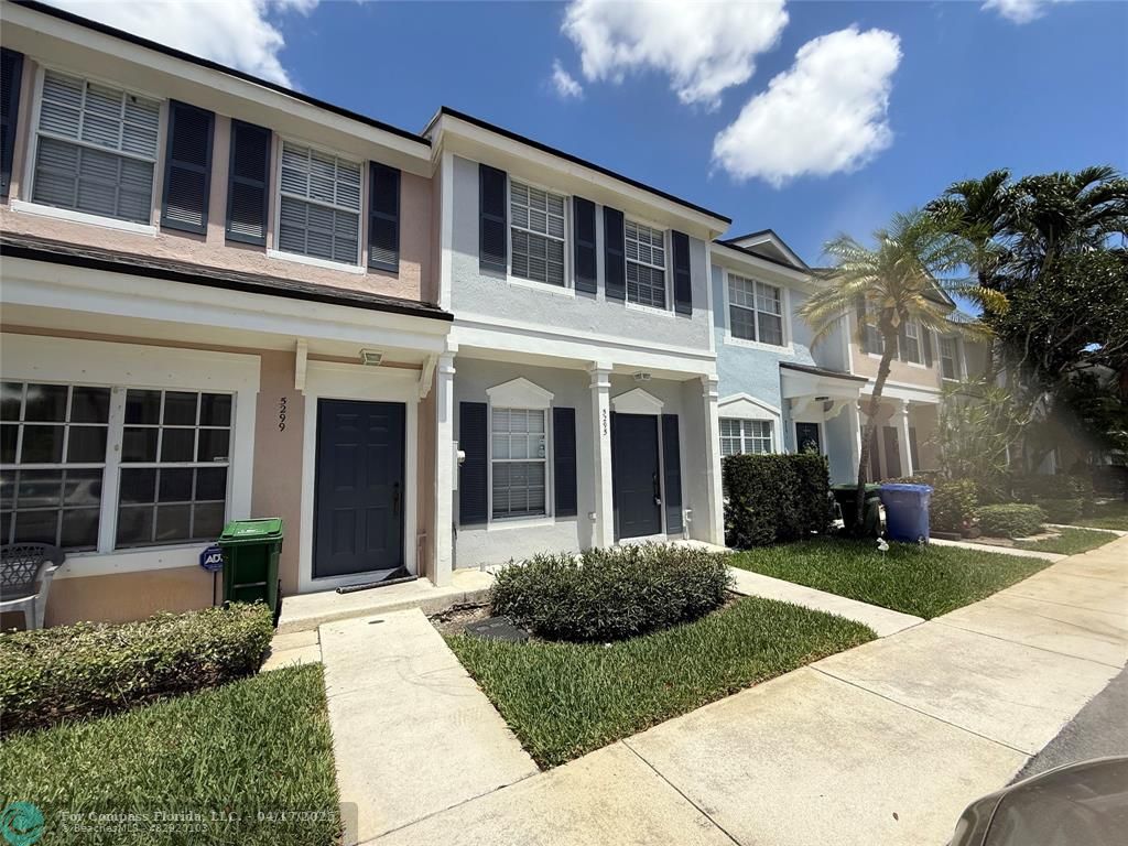 5295 Jamboree Place Margate, FL 33063 - Photo 2 of 35 a front view of a house with a yard