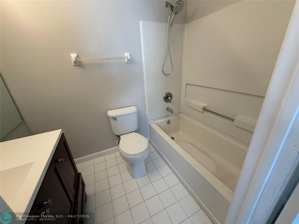 5295 Jamboree Place Margate, FL 33063 - Photo 31 of 35 a bathroom with a bathtub and toilet