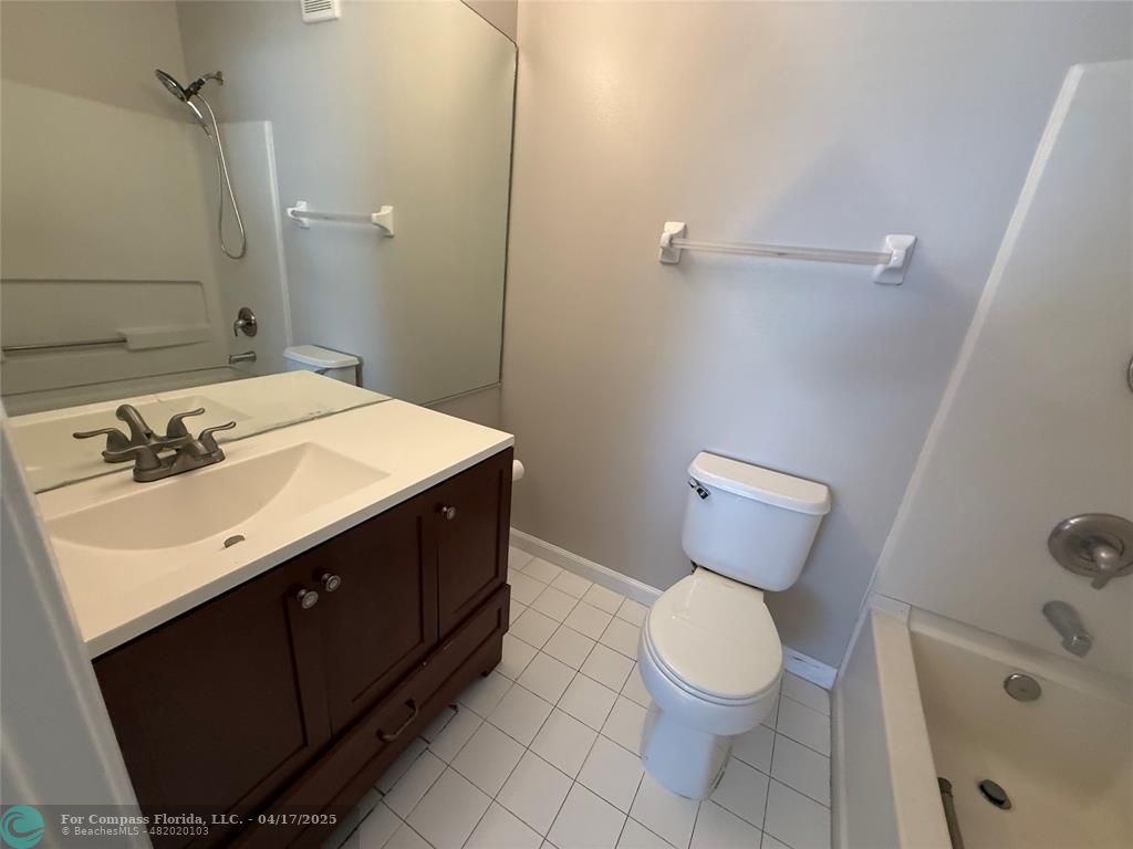 5295 Jamboree Place Margate, FL 33063 - Photo 33 of 35 a bathroom with a sink toilet and vanity