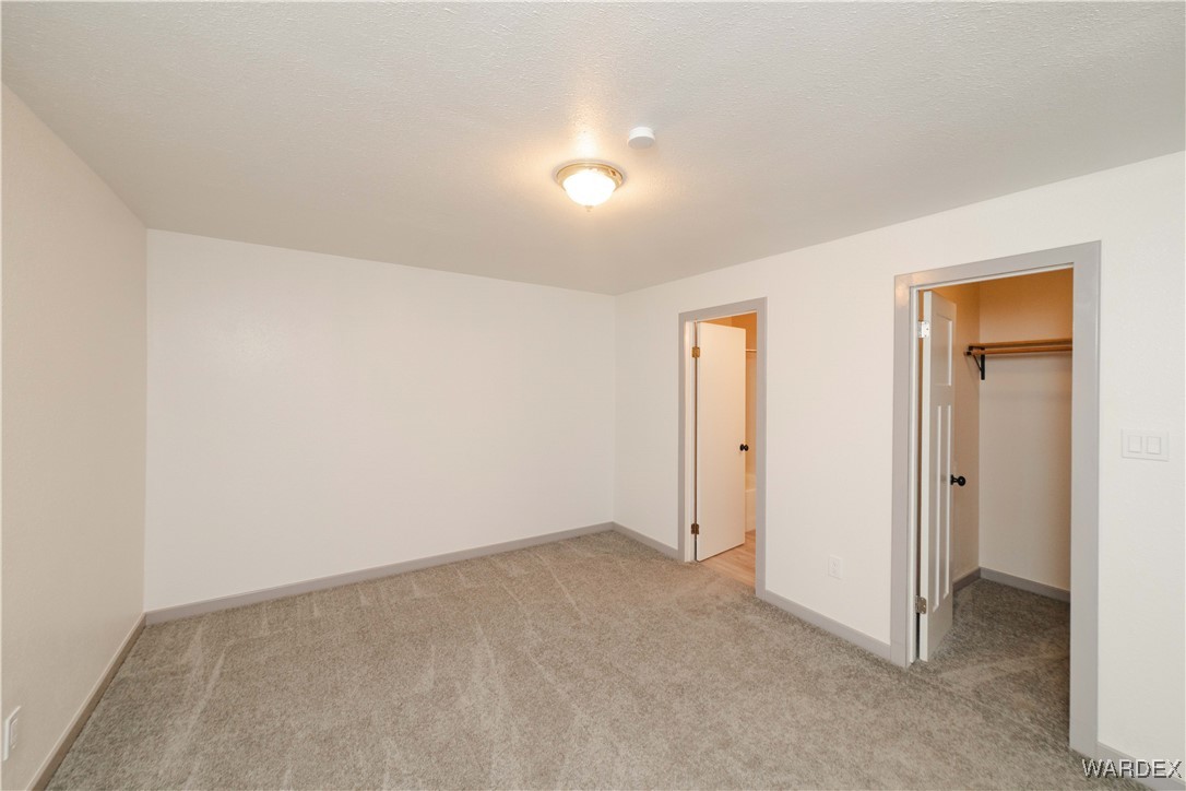 6846 Mormon Flat Road Golden Valley, AZ 86413 - Photo 21 of 50 Master Bedroom