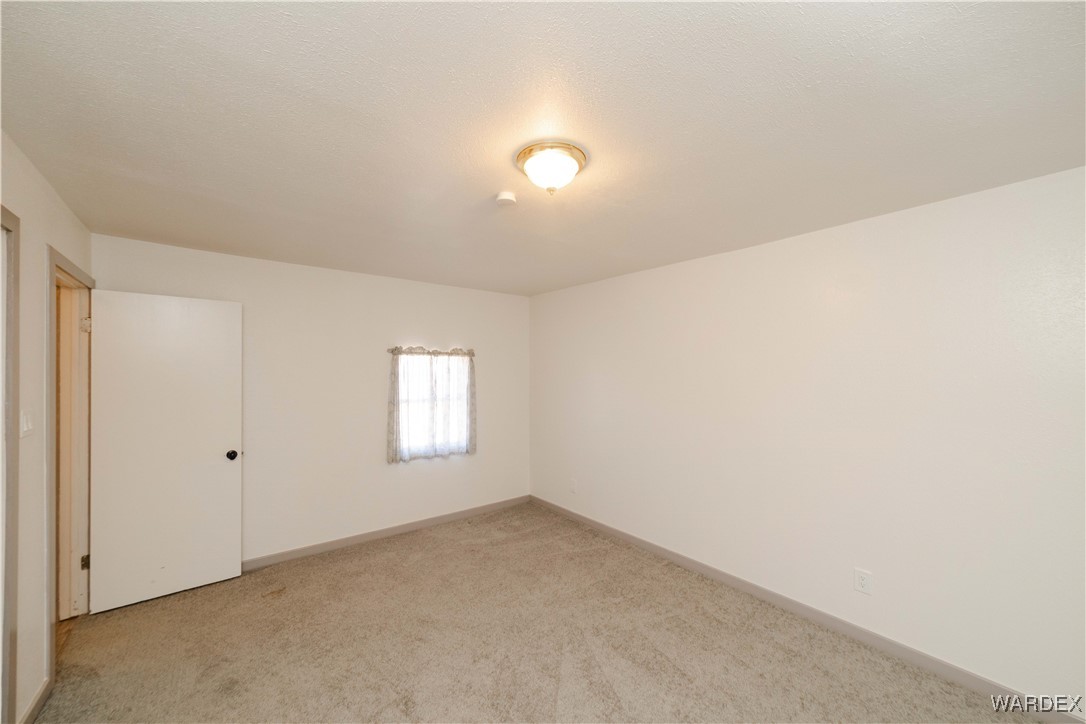 6846 Mormon Flat Road Golden Valley, AZ 86413 - Photo 23 of 50 Master Bedroom