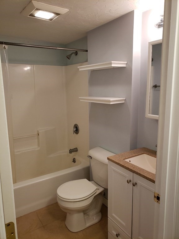 4 Tideview Path, Unit 11 Plymouth, MA 02360 - Photo 15 of 15 a white toilet sitting next to a bath tub