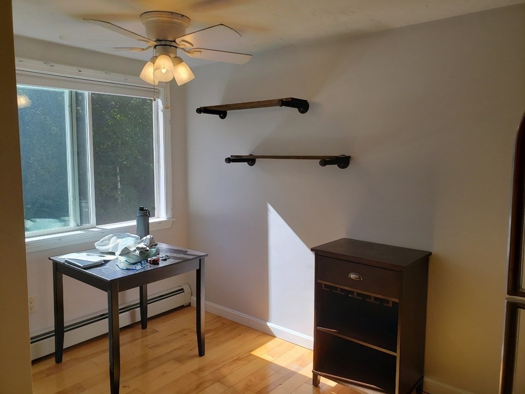 4 Tideview Path, Unit 11 Plymouth, MA 02360 - Photo 3 of 15 a living room with furniture and a window