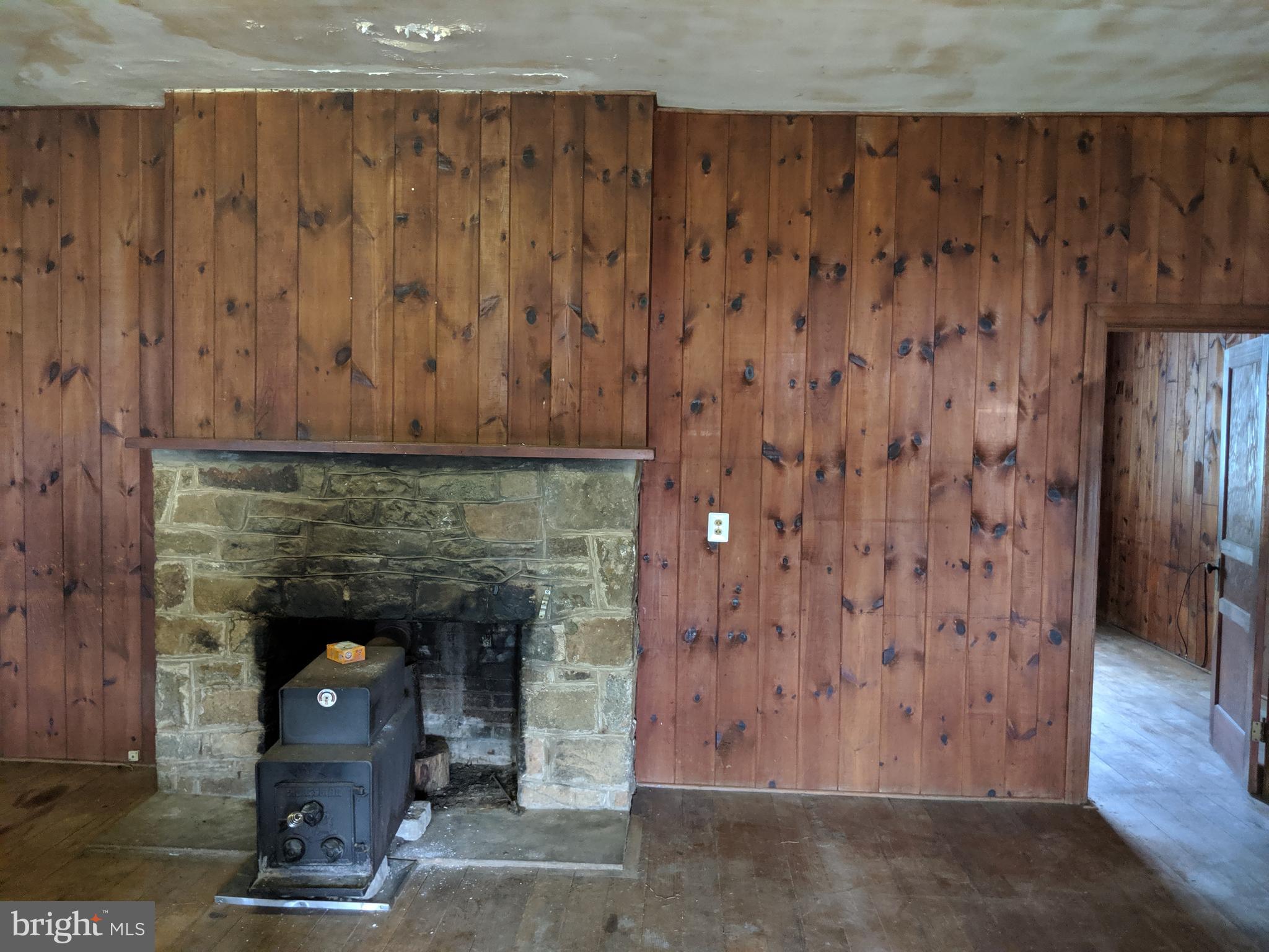 5723 Slate Mills Road Boston, VA 22713 - Photo 22 of 43 a living room with a fireplace